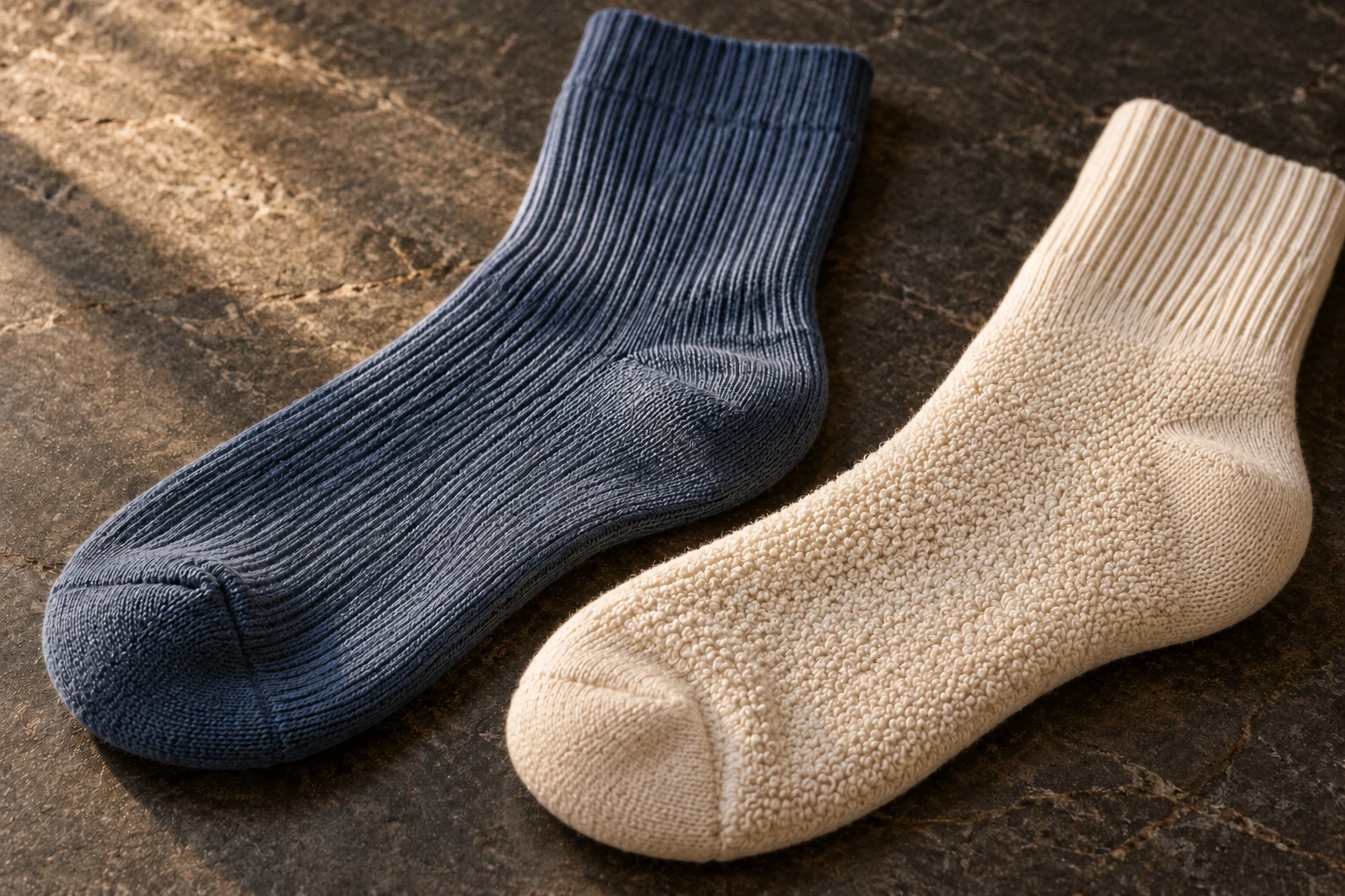 Close-up of ribbed sock fabric beside an inside-out terry-cushioned sock sole